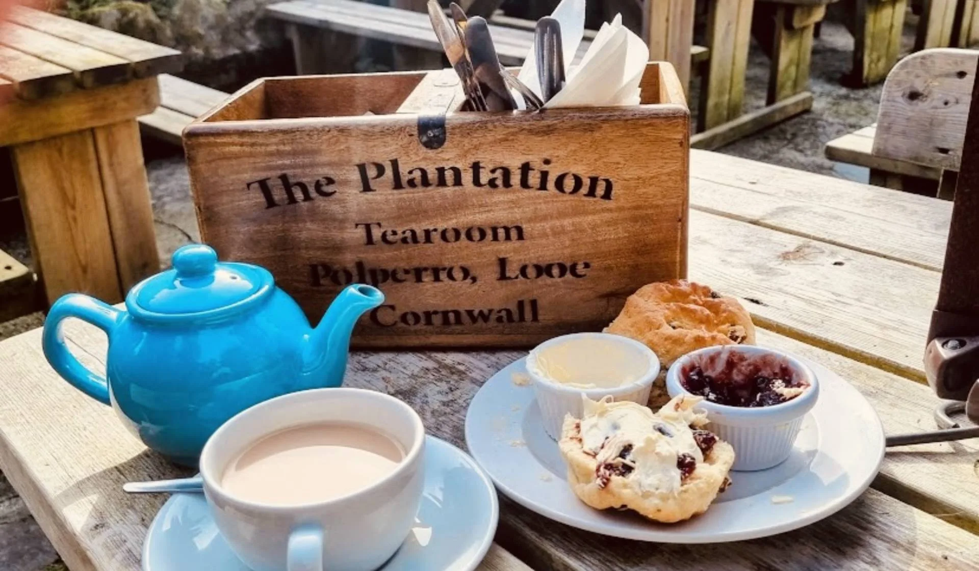 Tea and scones served on an outdoor table at The Plantation Tearooms